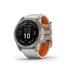 Kép betöltése a galériamegjelenítőbe: Garmin | FENIX 7X PRO SAPPHIRE SOLAR, TITÁNIUM, KÖDSZÜRKE-NARANCS SZÍNŰ SZILIKON SZÍJJAL (ED XD)
